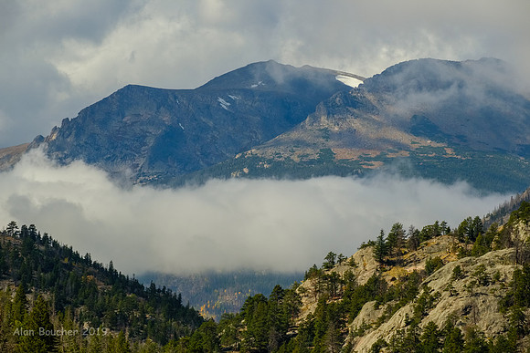 Clouds below the Mountains